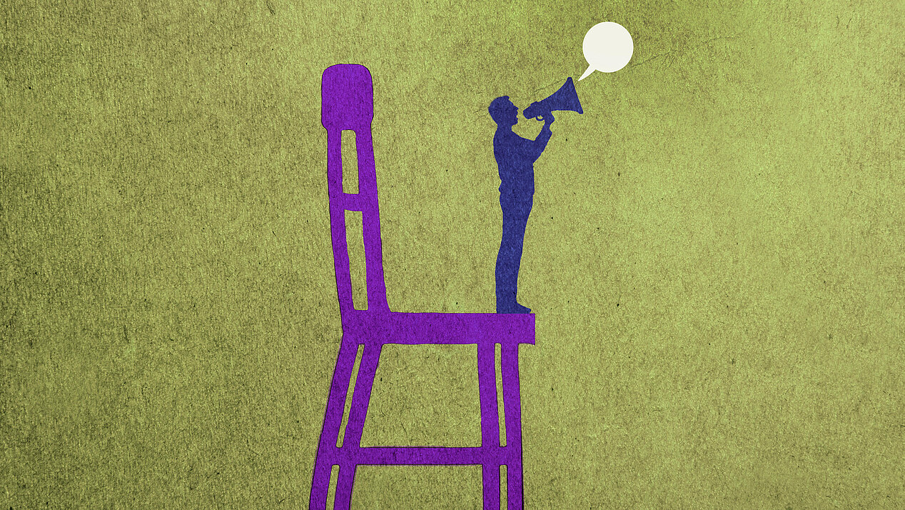 Illustration: A small man with a megaphone stands on a large chair.